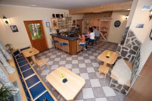 an overhead view of a restaurant with people sitting at tables at Prenočišča Valentina in Solčava