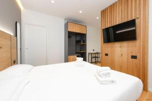 מיטה או מיטות בחדר ב-Hotel Mauro