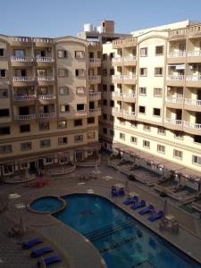 uitzicht op twee appartementsgebouwen en een zwembad bij Andalusia Resort - 2 Bedroom Apartment in Hurghada