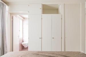 A bed or beds in a room at Hotel Bergidyll - Riders Haven
