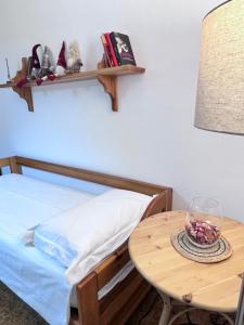 A bed or beds in a room at Gloria Holiday Home Bormio