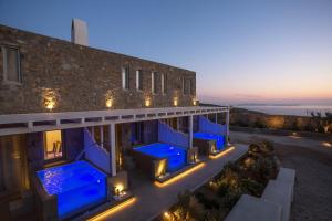 a house with blue lights on the side of it at Villa Panamera, Private Heaven, Supreme View in Fanari