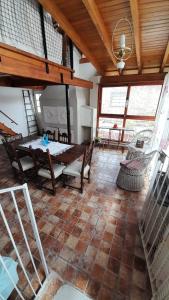 a large living room with a table and chairs at Doña Rita departamentos in Villa María