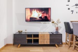 a living room with a fire in a fireplace at Zoder Apartments in Vienna