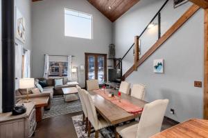 a dining room with a table and a living room at The Bross Ranch Cabin - Open Floor Plan! 10Mi to Ski Breck! Hot Tub! in Fairplay