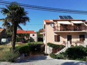 a house with solar panels on the roof at Apartments with a parking space Vrisnik, Hvar - 8733 in Jelsa