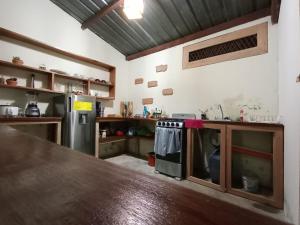 a kitchen with a wooden counter top in a room at Chill House Flores in Flores