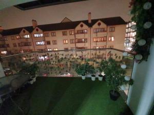 a view of a building with a courtyard with plants at Wallwood Rooms in London