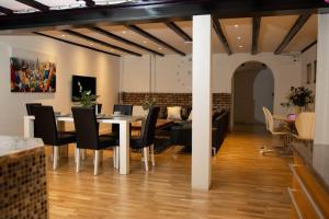 a dining room with a table and chairs at Historical Malt Factory Apartment, 6 Bedrooms, sleeps 12 , Hot Tub in Helsingborg