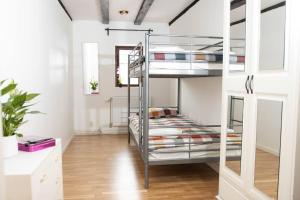 a bedroom with bunk beds in a room at Historical Malt Factory Apartment, 6 Bedrooms, sleeps 12 , Hot Tub in Helsingborg