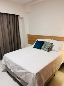 A bed or beds in a room at Makia Beach Experience