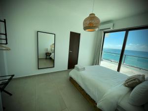 Voodi või voodid majutusasutuse 1 Corcega Beachfront Suites toas