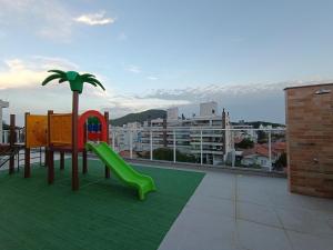 a playground on the roof of a building at Vila do Centro in Bombinhas