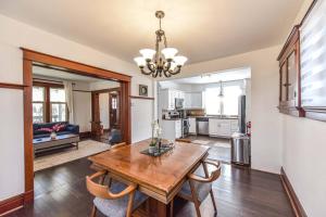a kitchen and dining room with a table and chairs at Charming 3BR Century Home in Downtown Barrie in Barrie