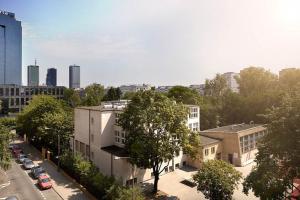 an overhead view of a city with buildings and trees at Lovely Sunny Flat in City Center in Warsaw