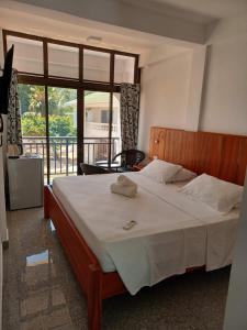 Postel nebo postele na pokoji v ubytování Jamelah Beach Guest House