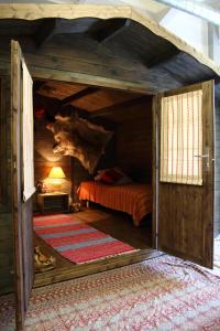 a small bedroom with a bed in a room at Guesthouse Little Tundra in Lahti