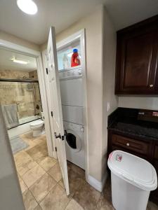 a bathroom with a toilet and a sink and a shower at Venetian La Jolla One bedroom condo luxury furnished near beach and UTC mall in San Diego