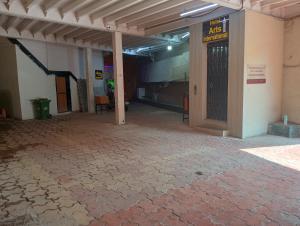 an empty hallway of a building with a door at Arts International in Mumbai