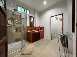 a bathroom with a shower and a sink at Creek Cottage Chaeson in Ban Mun Thung +116 photos