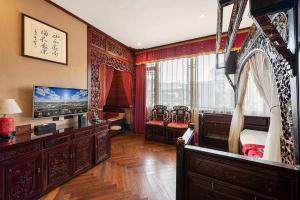 Télévision ou salle de divertissement dans l'établissement ChengDu Wuhou Temple Han Dynasty Hotel