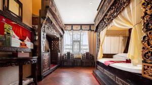 Un ou plusieurs lits dans un hébergement de l'établissement ChengDu Wuhou Temple Han Dynasty Hotel