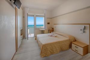 Кровать или кровати в номере Hotel Continental +18 фотографий