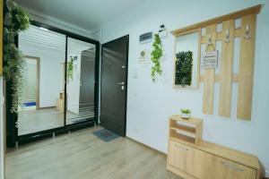 a room with a hallway with a glass door at Plaza View in Bucharest
