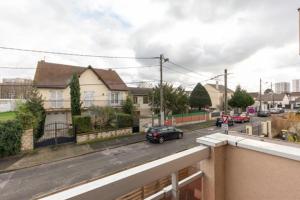 a view of a street with cars on the road at Le Cosy 2,proche Paris,Aéroport,Parc D’exposition in Sevran