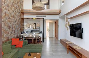 TV a/nebo společenská místnost v ubytování VESTA - El Gouna Residence