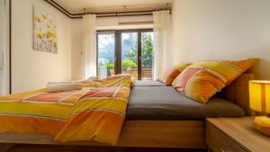 Ένα ή περισσότερα κρεβάτια σε δωμάτιο στο Apartman Ornela