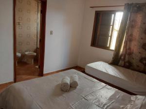 Cama o camas de una habitación en Casas Amarelas - Praia Grande, Ubatuba