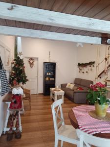 a living room with a christmas tree and a couch at Casa Mama Fela in Arucas