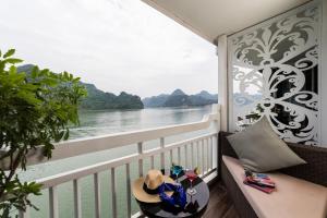 a balcony with a view of the water at Lotus D'Orient Cruise in Ha Long