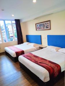 Postel nebo postele na pokoji v ubytování HOTEL YTS