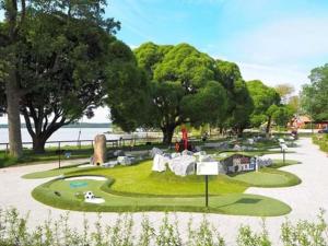 a miniature golf course in a park near the water at Lovely studio in the citycenter of Sigtuna in Sigtuna +10 photos
