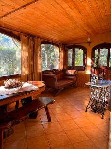 a living room with a couch and some windows at Ca' Datu in Finale Ligure