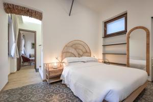 Casa del Barbarossa - GenovaInRelax tesisinde bir odada yatak veya yataklar