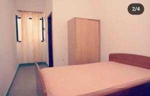 Postel nebo postele na pokoji v ubytování Apartmani Lorena