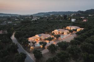 an aerial view of a house with lights at Nono's Fioro Premium Houses, By TK Property Management in Gaïtánion