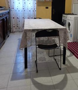 a table with a white table cloth on it in a kitchen at B&B centro di livorno in Livorno