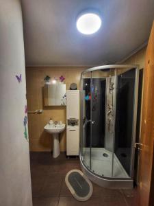 a bathroom with a shower and a sink at La Simo in Sinaia