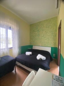 Posteľ alebo postele v izbe v ubytovaní La Foresteria