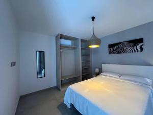 En eller flere senge i et værelse på Villa Esperanza by Villalia