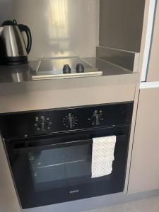 a kitchen with a stove with a towel on the oven at Magic Appartement Luxury Gauthier 10 in Casablanca