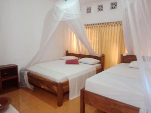 Voodi või voodid majutusasutuse fullesguesthouse toas