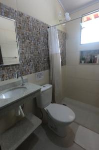 Koupelna v ubytování Recanto Guarassol Apartamentos