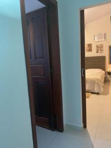 Postel nebo postele na pokoji v ubytování Recanto Guarassol Apartamentos