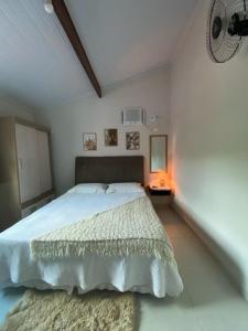 Postel nebo postele na pokoji v ubytování Recanto Guarassol Apartamentos