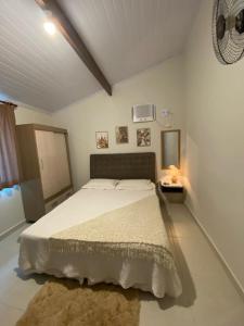 Postel nebo postele na pokoji v ubytování Recanto Guarassol Apartamentos + 37 fotografií
